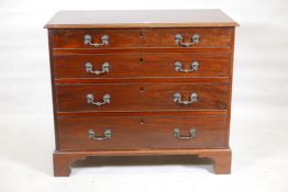 A Georgian Chippendale style mahogany chest of four long drawers, with cockbeaded detail, oak
