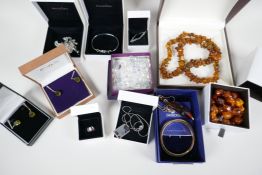 A quantity of good quality costume jewellery including silver, faux amber, Pandora, Swarovski etc