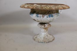A Victorian cast iron campagna garden urn of flared, fluted, classical form, aged surface with