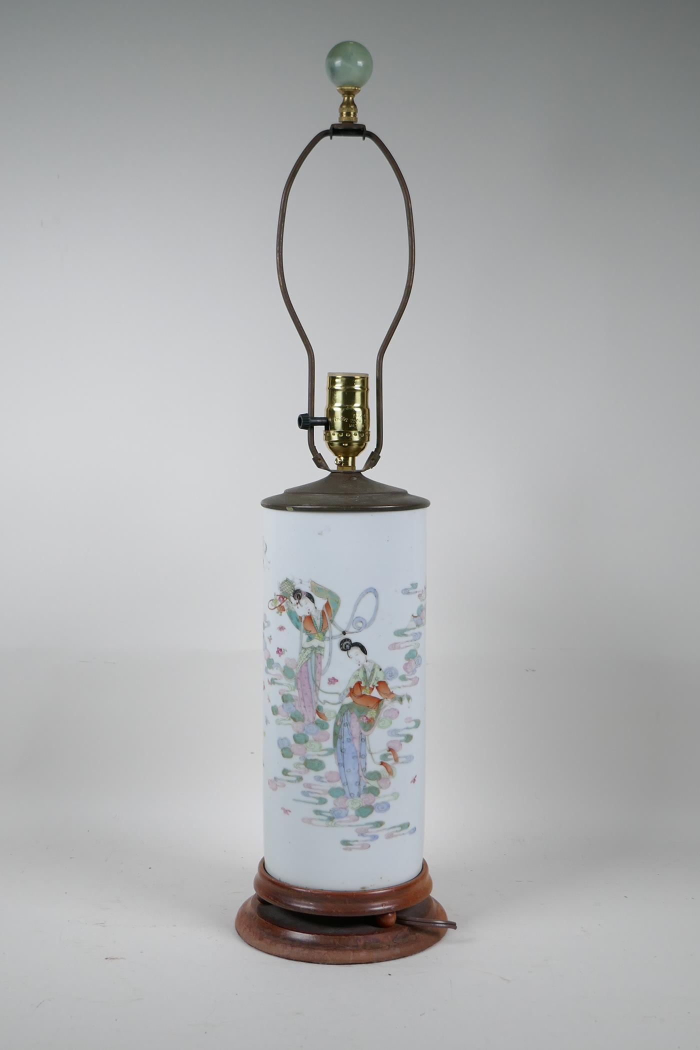 A Chinese famille rose porcelain cylinder vase converted to a lamp with a hardwood base and brass