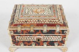 An Oriental bone and tortoiseshell trinket box, with carved and pierced penwork decoration, interior