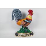 A painted cast iron doorstop in the form of a cockerel, 14" high