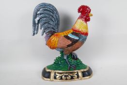 A painted cast iron doorstop in the form of a cockerel, 14" high