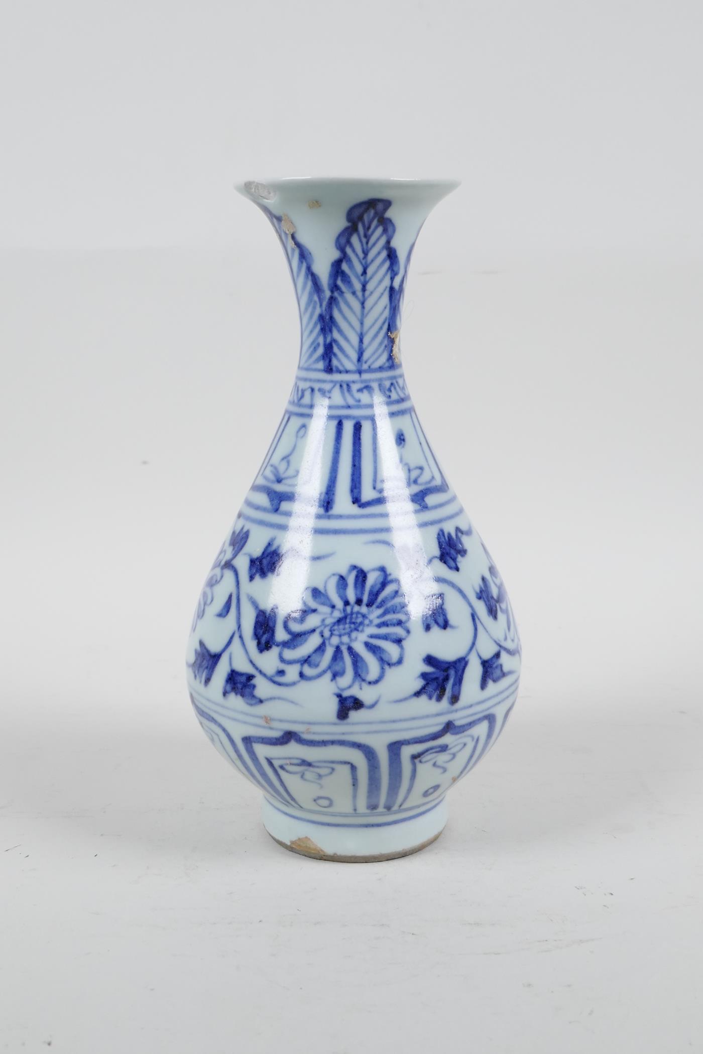 A Chinese blue and white porcelain pear shaped vase with scrolling floral decoration, 7½" high, A/