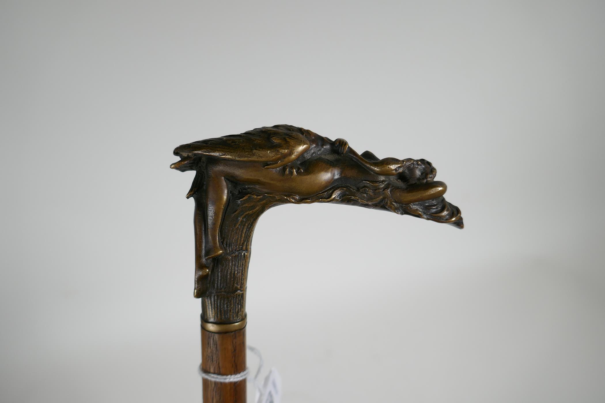 A vintage walking stick with bronze handle in the form of a nude woman and swan, signed Cardoe, - Image 2 of 4