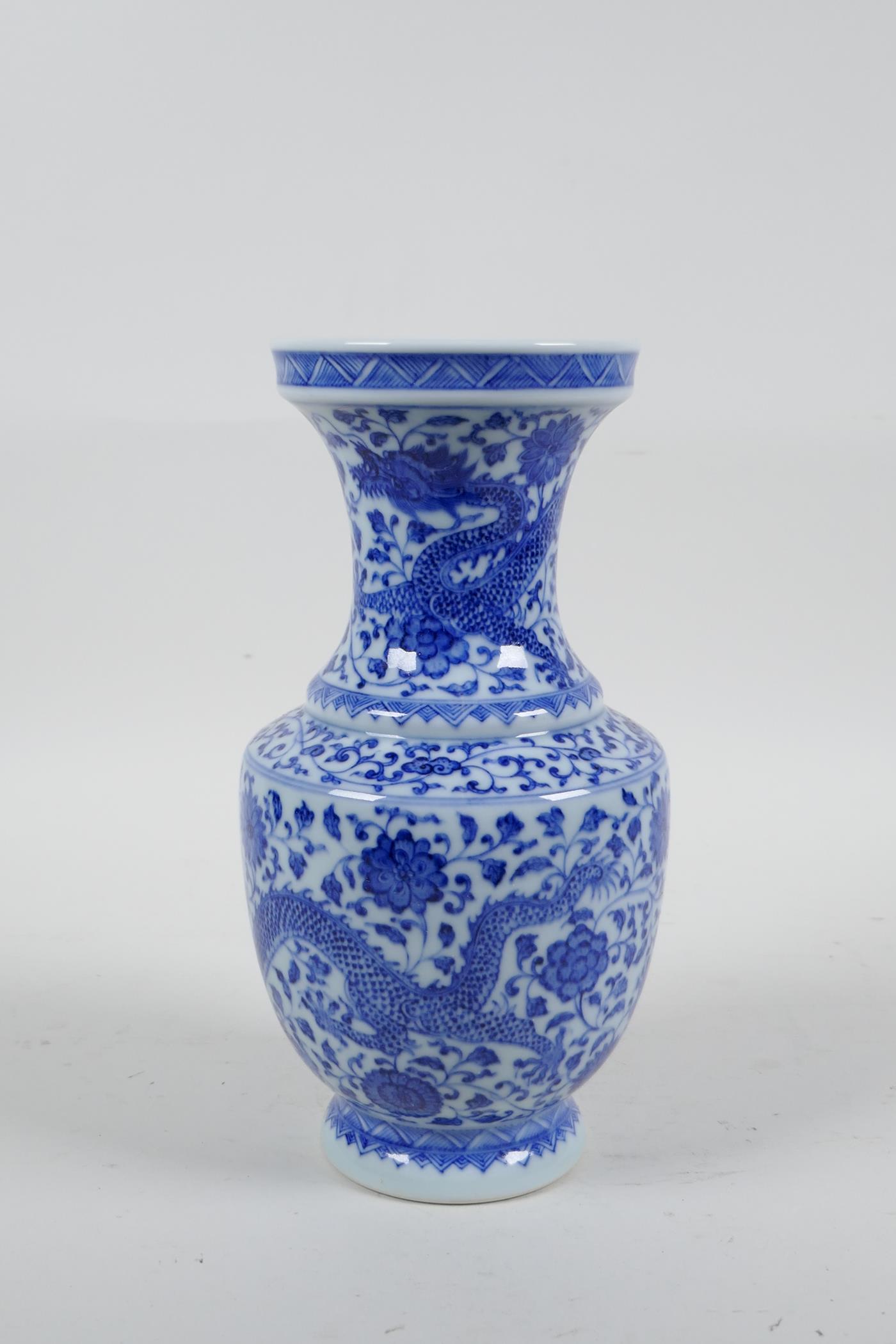 A Chinese blue and white porcelain vase with dragon and lotus flower decoration, seal mark to - Image 2 of 5