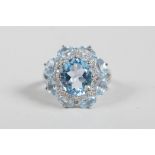 A 925 silver ladies' dress ring set with cubic zirconium and blue topaz, approximate size 'N'