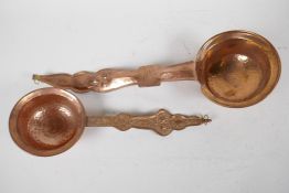 Two Tibetan hammered copper ladles, longest 13"