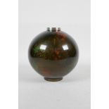 A Japanese enamelled metal globular vase with green and red speckled decoration on a bronze style