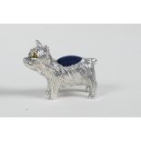 A sterling silver pincushion in the form of a dog, 1" long