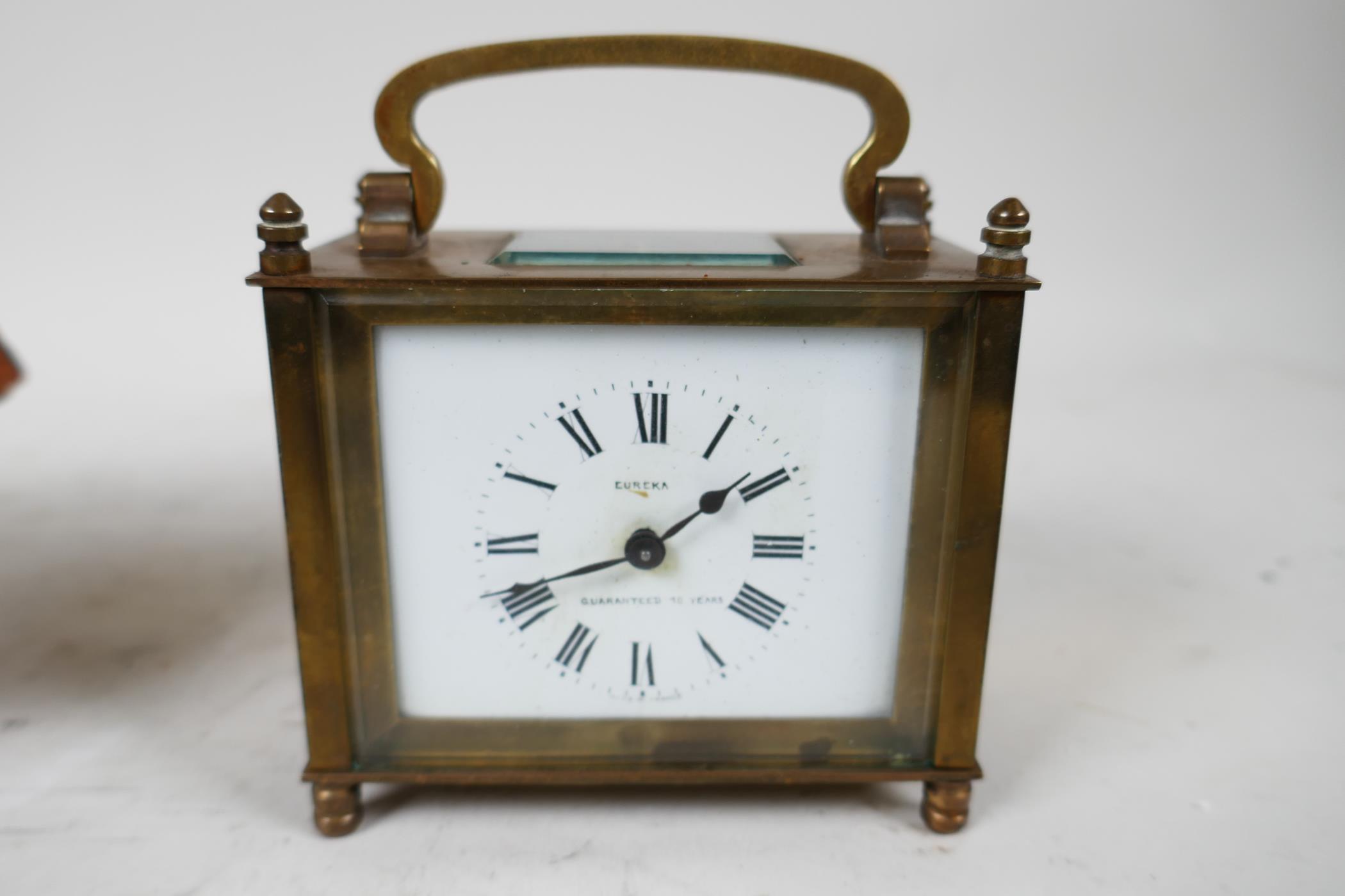 A Eureka brass cased carriage clock in a travel case, the clock with white enamel dial and Roman - Image 2 of 7