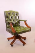 A button leather swivel desk chair, 38" high