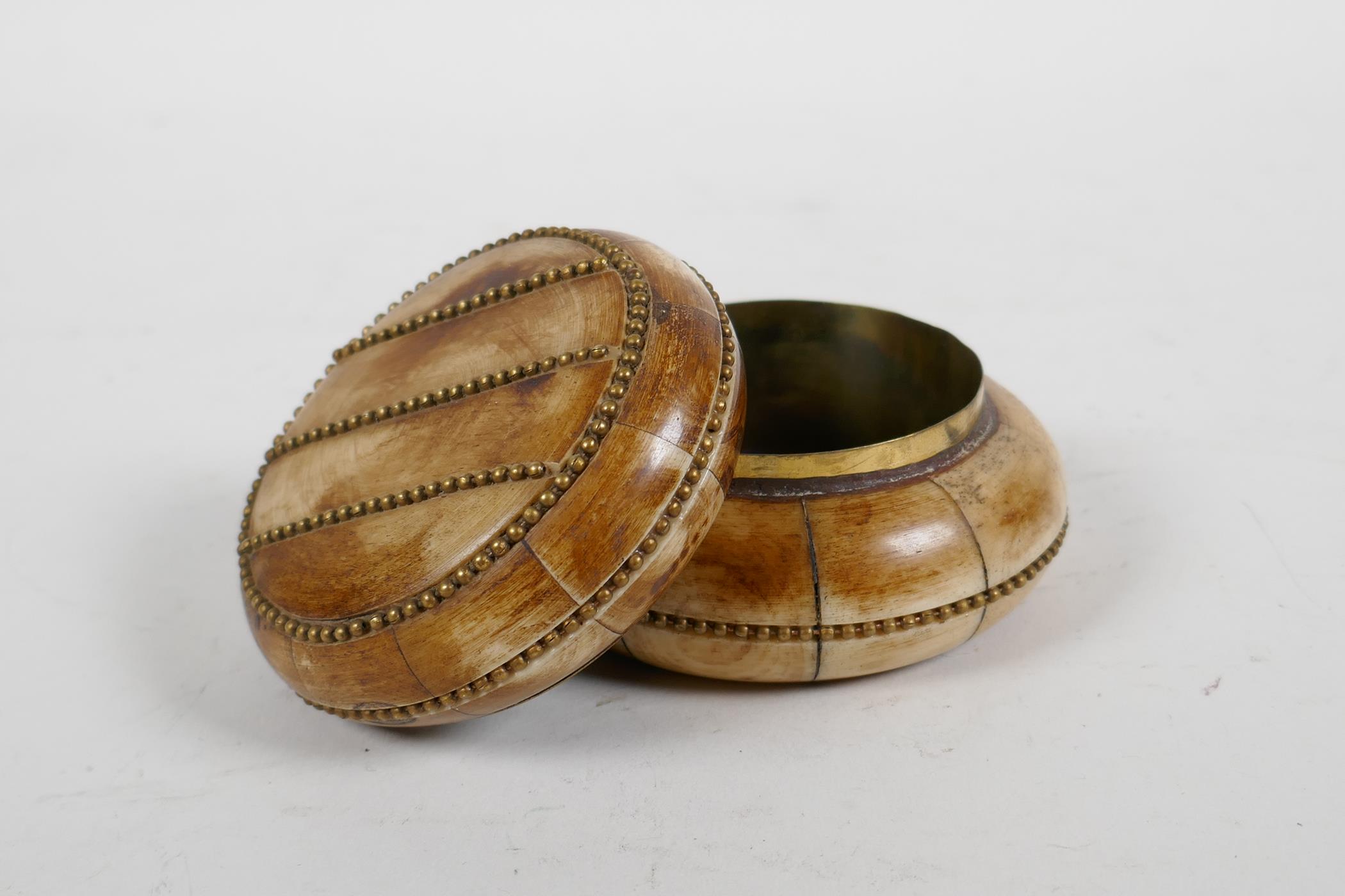A sectional bone box and cover with brass beaded details, 3" diameter - Image 4 of 4