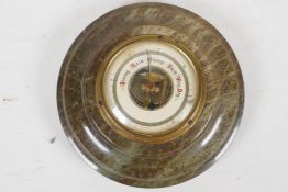A serpentine cased aneroid barometer, 7" diameter