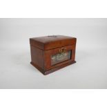 A C19th walnut jewellery box with a glass panelled fall front and fitted interior, 7½ x 5½"