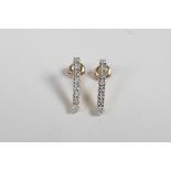 A pair of 9ct yellow gold and diamond set drop earrings