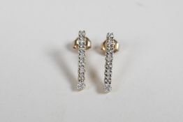 A pair of 9ct yellow gold and diamond set drop earrings