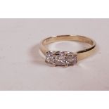 An 18ct white gold ring set with three diamonds, 0.5ct, 2.6g, size 'M'