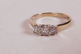 An 18ct white gold ring set with three diamonds, 0.5ct, 2.6g, size 'M'