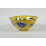 A Chinese Ming style yellow ground porcelain rice bowl with blue and white floral decoration, 6