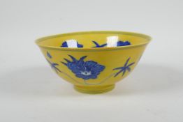 A Chinese Ming style yellow ground porcelain rice bowl with blue and white floral decoration, 6