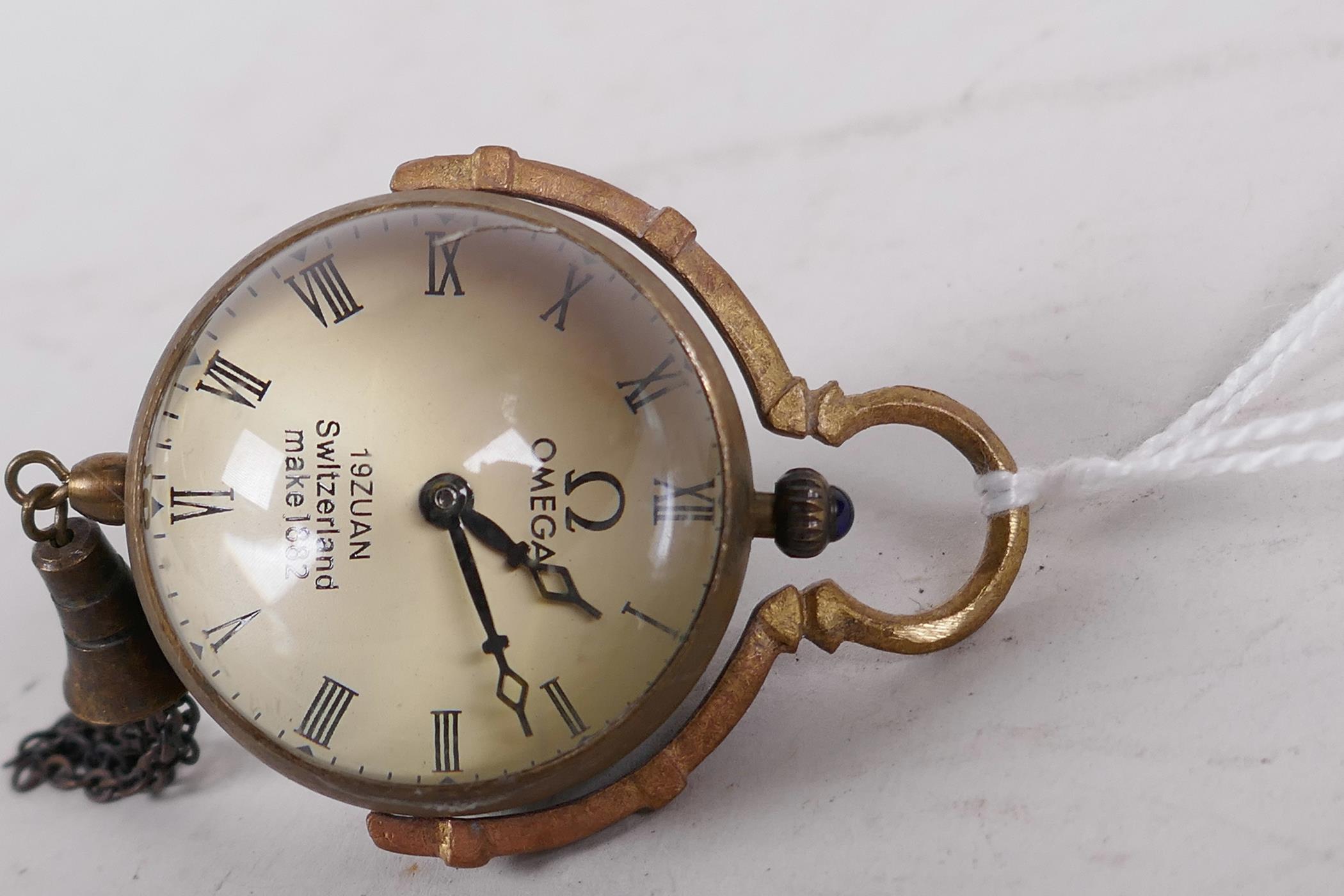 A small glass and brass pendant ball watch, 1¼" diameter - Image 2 of 3