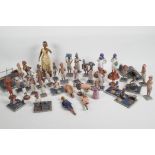 A collection of 41 vintage Indian painted wood and terracotta figures