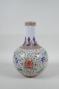 A Chinese famille rose enamelled porcelain vase with scrolling lotus flower decoration, seal mark to