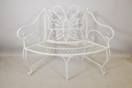 A painted wrought metal curved garden bench with butterfly decoration, 40" high