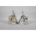 A pair of Lladro style figures of a Chinese man and woman seated on a bench, 7½" high