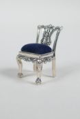 A sterling silver pincushion in the form of a Chippendale chair, 1½"