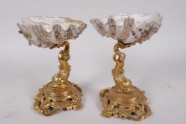 A pair of antique French ormolu and shell table salts cast as dolphins on scrolled bases with