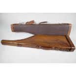 An antique leather 'Leg of Mutton' shotgun case, 31" long, together with a vintage shotgun case