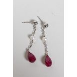 A pair of white gold, ruby and pearl drop earrings, 1" drop