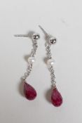 A pair of white gold, ruby and pearl drop earrings, 1" drop