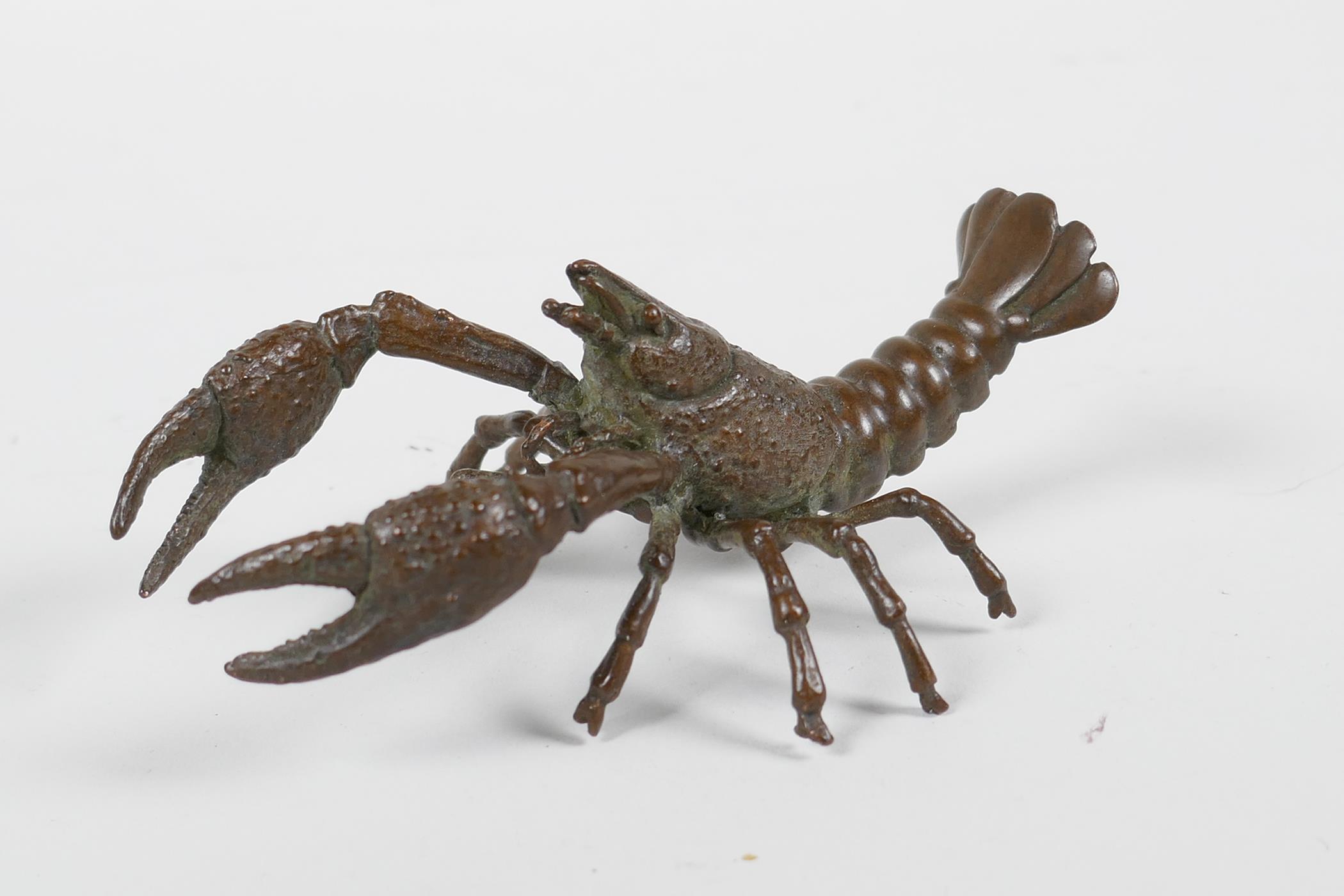 A Japanese Jizai style bronze crayfish, impressed mark to base, 4" long