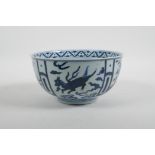 A Chinese blue and white porcelain bowl decorated with flowers and horses in flight, 6 character