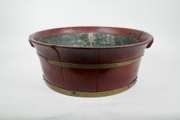 A brass banded fruitwood jardiniere with a metal liner, losses, 17" diameter, 6" high