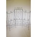 A three fold metal garden screen in the Gothic style, 71" high