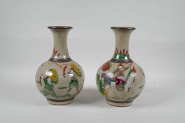 A pair of Chinese crackleware pottery vases with famille verte enamel decoration of warriors, mark