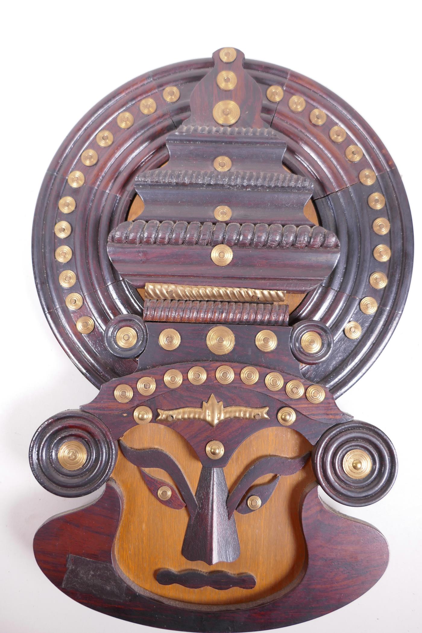 An Indian Kathakali wooden wall mask decorated with brass studding, 17" x 12" - Image 2 of 2