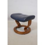 An Ekornes stool upholstered in blue, 14½" high