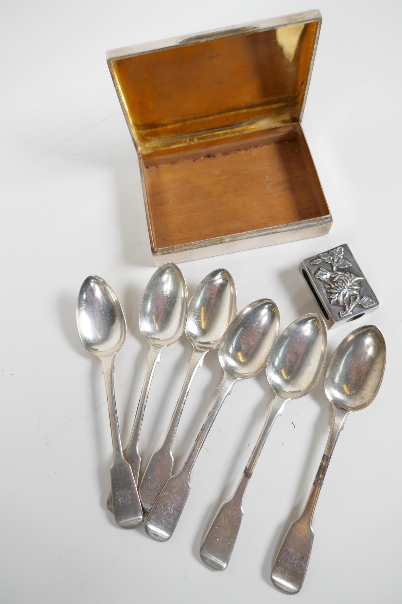A hallmarked silver cigarette box (Birmingham 1922), together with a set of six hallmarked