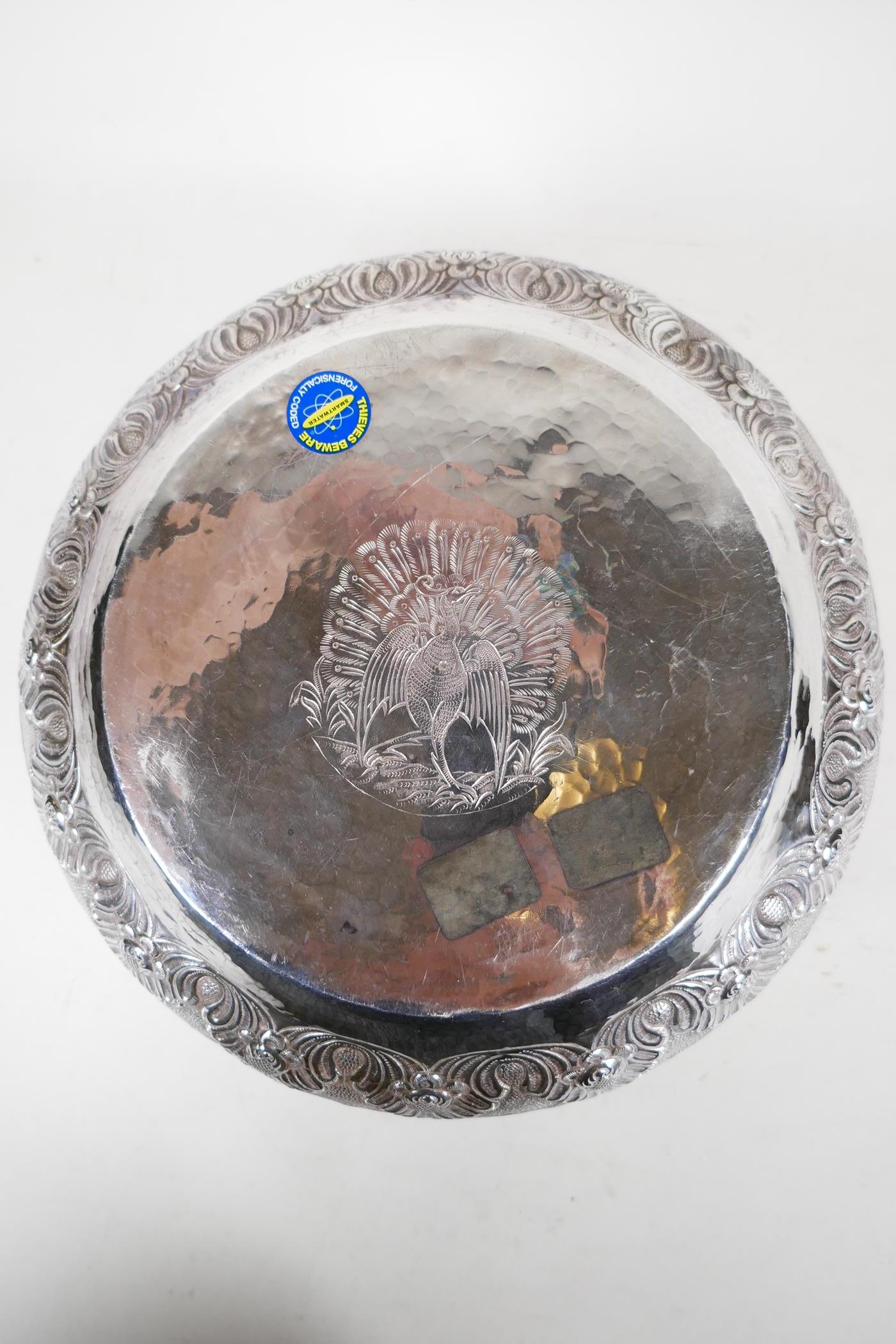 An antique Indian silver bowl, hammered silver with embossed scrolling decoration, a bas relief - Image 6 of 8