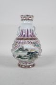 A Chinese famille rose porcelain two handled vase of ribbed form, with decorative panels depicting