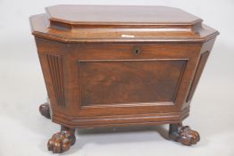 A Regency mahogany inlaid sarcophagus shaped cellarette, with panelled sides and front, and fitted