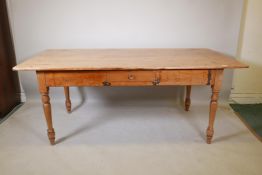 A C19th French single drawer scullery table, with pine planked top, raised on turned supports, 75" x
