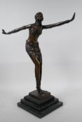 An Art Deco style bronze figure of a dancing girl in the manner of Preiss on a stepped plinth, 15"