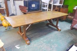 An oak tavern table with plank top, on twin pillar end supports, 30" high, 96" long, 36" wide