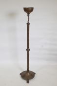 A tall Victorian adjustable oil lamp stand on a heavy circular base and three paw feet, 51" high